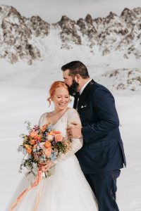 Snowy-spring-Colorado-elopement-with-bright-colored-bouquet-by-Alicia-D'Elia-Photography