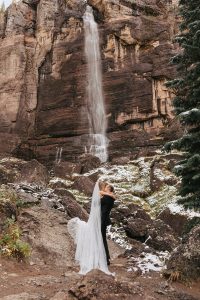 A fall Telluride elopement combining fall colors and fresh snow in the San Juan Mountains. Featuring a vow exchange at Bridal Veil Falls.