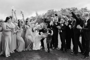 A vibrant summer wedding at The Oaks in Colorado featuring Alena Leena bridal and bold florals by Eleven Blooms Floral.