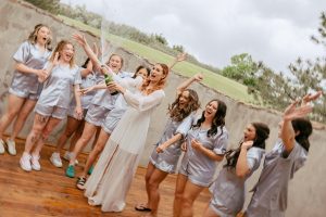 A vibrant summer wedding at The Oaks in Colorado featuring Alena Leena bridal and bold florals by Eleven Blooms Floral.
