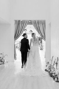 A vibrant summer wedding at The Oaks in Colorado featuring Alena Leena bridal and bold florals by Eleven Blooms Floral.