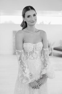 A vibrant summer wedding at The Oaks in Colorado featuring Alena Leena bridal and bold florals by Eleven Blooms Floral.